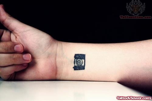 Small Camera Tattoo On Wrist