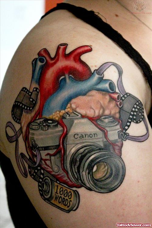 Heart And Camera Tattoo On Shoulder