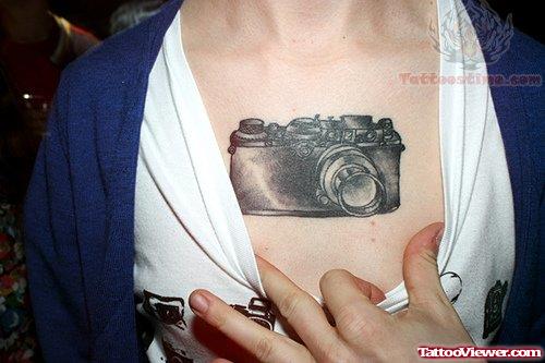 Black Camera Tattoo On Chest