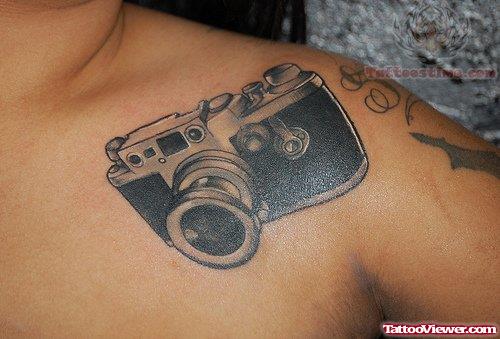 Black Ink Camera Tattoo On Shoulder