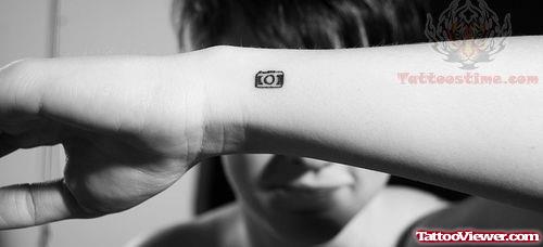 Tiny Camera Tattoo On Wrist