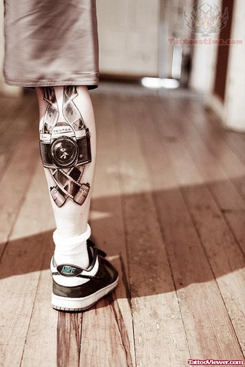 Camera And Film Tattoo On Calf