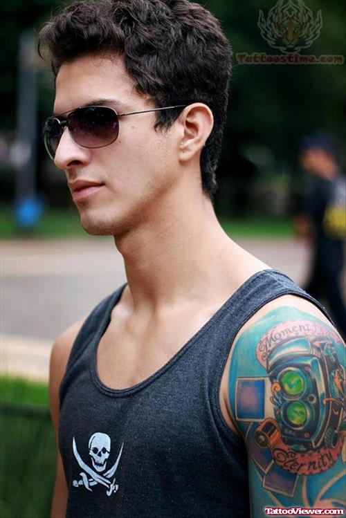 Color Ink Camera Tattoo On Boy Shoulder