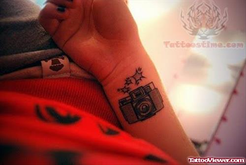 Shining Camera Tattoo On Wrist