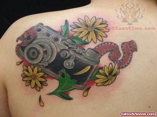 Flowers And Camera Tattoo On Back Shoulder