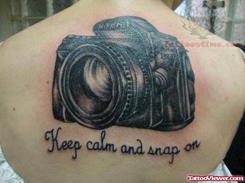 Large Camera Tattoo On Upper Back