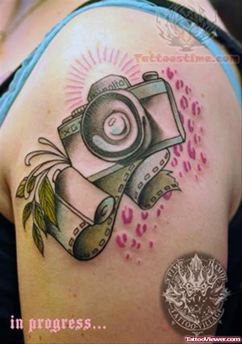 Camera And Film Tattoo On Shoulder