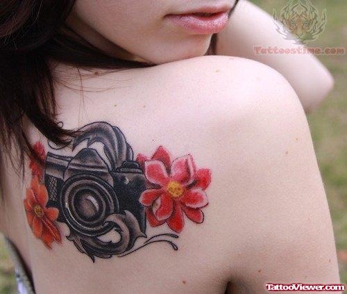 Camera And Flowers Tattoo On Back Shoulder
