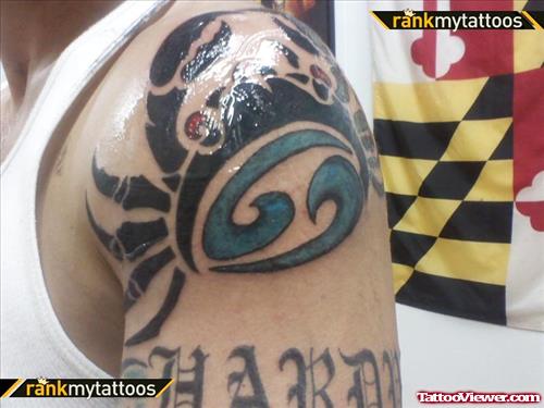 Tribal Cancer Sign Tattoo On Left Shoulder