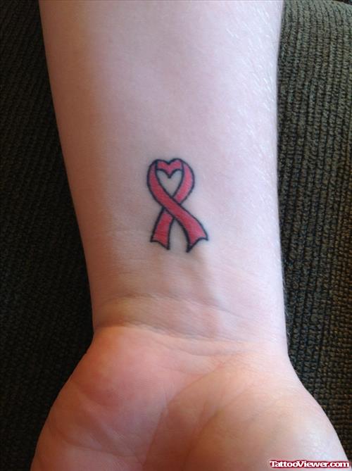 Red Ribbon Cancer Tattoo On Wrist