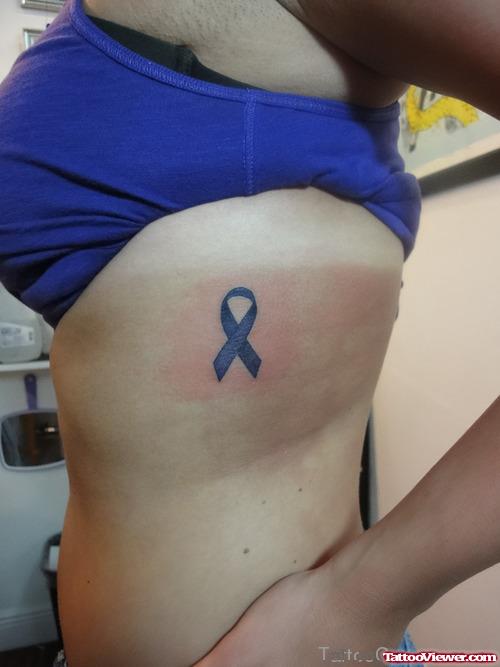 Girl Rib side Blue Ribbon Cancer Tattoo