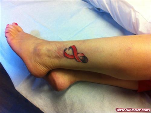 Red Ink Lung Cancer Tattoo On Left Leg