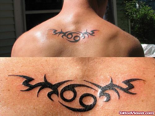Black Tribal Cancer Tattoo On Upperback
