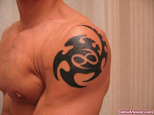 Tribal Cancer Tattoo On Left Shoulder