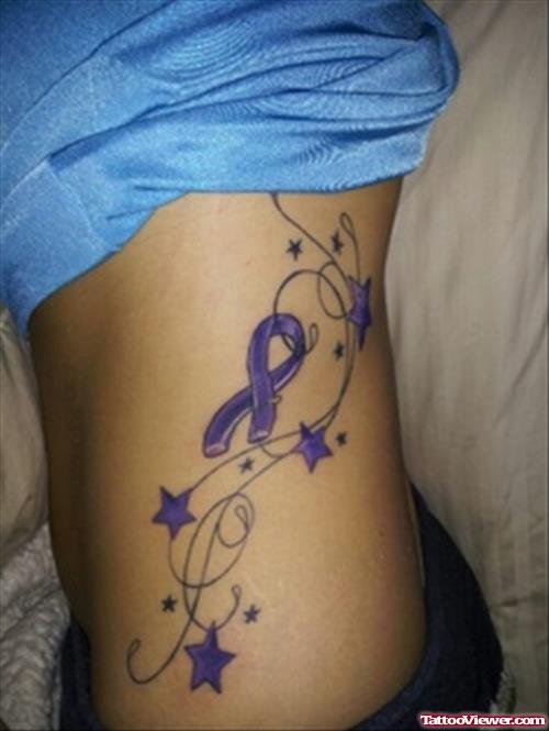 Purple Stars And Ribbon Cancer Tattoo On Side Rib