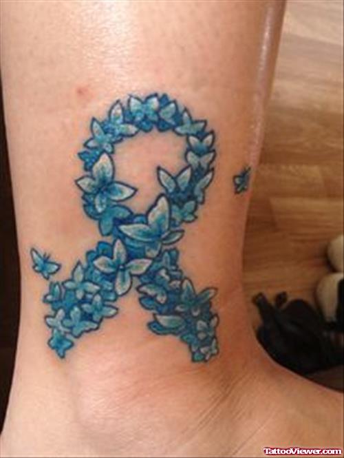 Blue Ink Flowers Ribbon Cancer Tattoo On Ankle