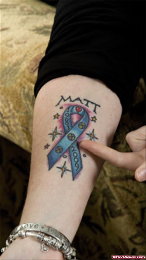 Stars And Blue Ribbon Cancer Tattoo On Forearm