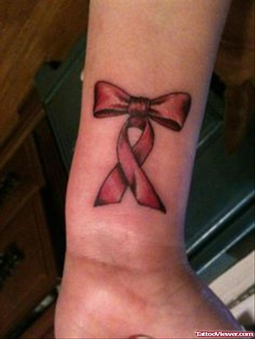 Red Ink Ribbon Cancer Tattoo On Wrist