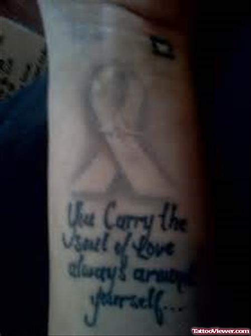 Lettering And Ribbon Cancer Tattoo On Wrist