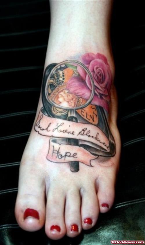 Magnifying Glass With Flowers And Ribbon Cancer Tattoo
