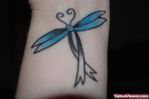 Dragonfly Cancer Tattoo On Left Forearm
