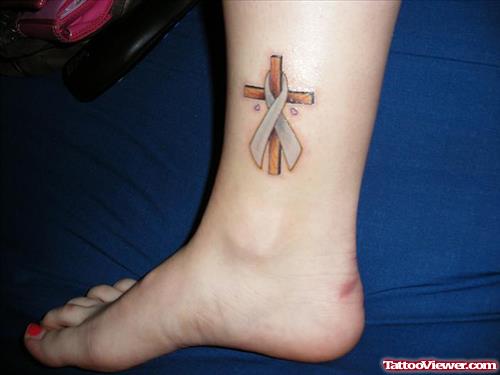 Cross And Ribbon Cancer Tattoo On Leg