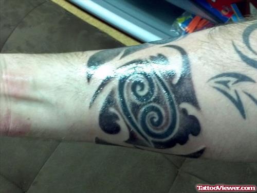 Black Ink Tribal Cancer Tattoo On Forearm