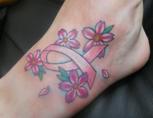 Pink Flowers And Cancer Tattoo On Right Ankle