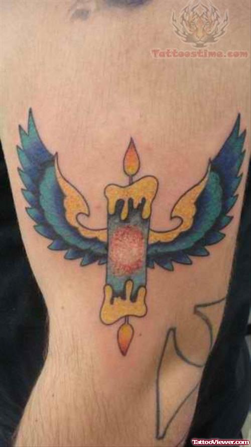 Winged Candle Burning At Both Ends Tattoo On Arm