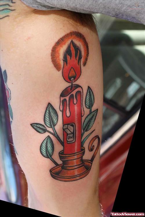 Flaming Candle Tattoo On Muscle