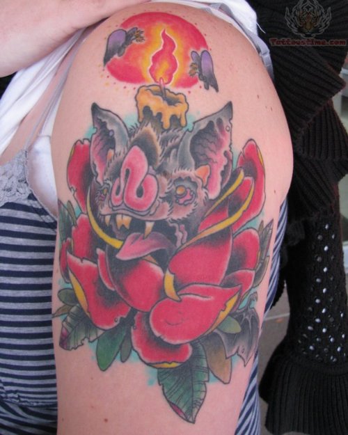 Flowers And Burning Candle Tattoo