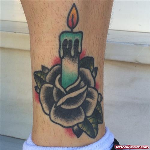 Burning candle on flower tattoo