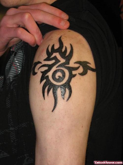 Black Ink Tribal Capricorn Tattoo On Shoulder