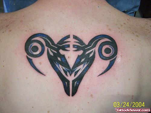 Black Ink Tribal Capricorn Tattoo On Back