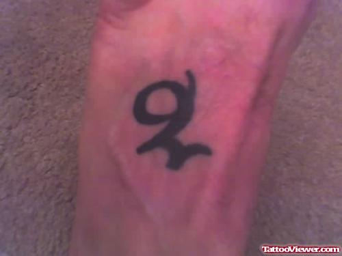 Black Ink Small Capricorn Tattoo On Foot