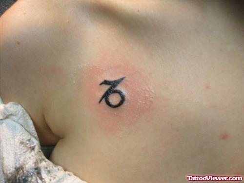 Tiny Capricorn Zodiac Tattoo On Girl Chest