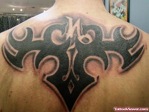Awesome Tribal Capricorn Tattoo On Upperback