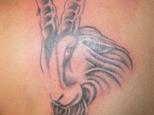 Red Eye Goat Head Capricorn Tattoo