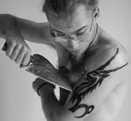 Tribal Capricorn Tattoo On Man Left Half Sleeve
