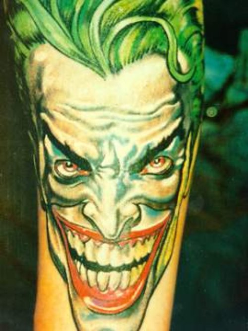Joker Head Cartoon Tattoo On Sleeve