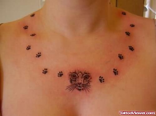 Cat Face And Foot Prints Tattoo