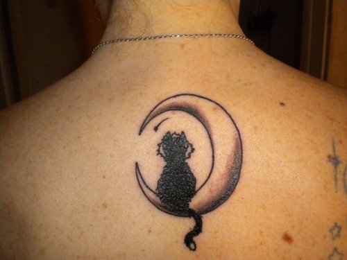 Black Cat Sitting On Moon Tattoo On Upperback