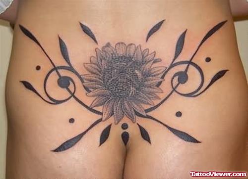 Celtic Sun Flower Tattoo On Lower Back