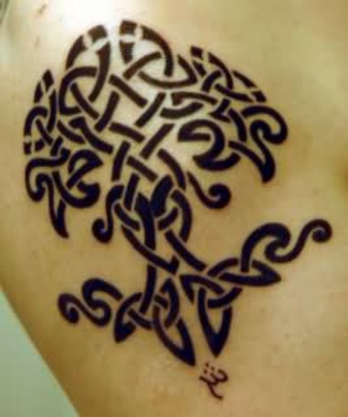 Black Ink Celtic Tattoo On Side Rib