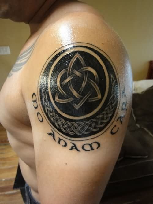 Black Ink Celtic Tattoo On Left Shoulder