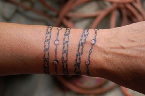 Grey Ink Chain Tattoo On Left Arm