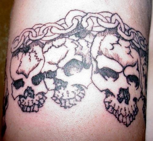 Grey Skulls And Chain Tattoo