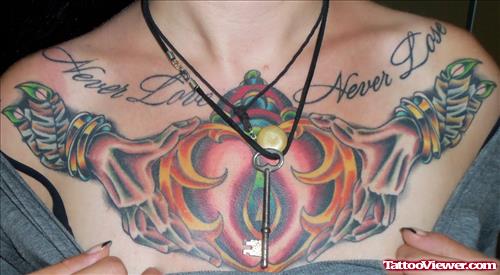 Heart In Hand Color Ink Chest Tattoo