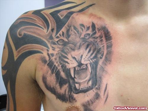 Tribal And Tiger Head Chest Tattoo