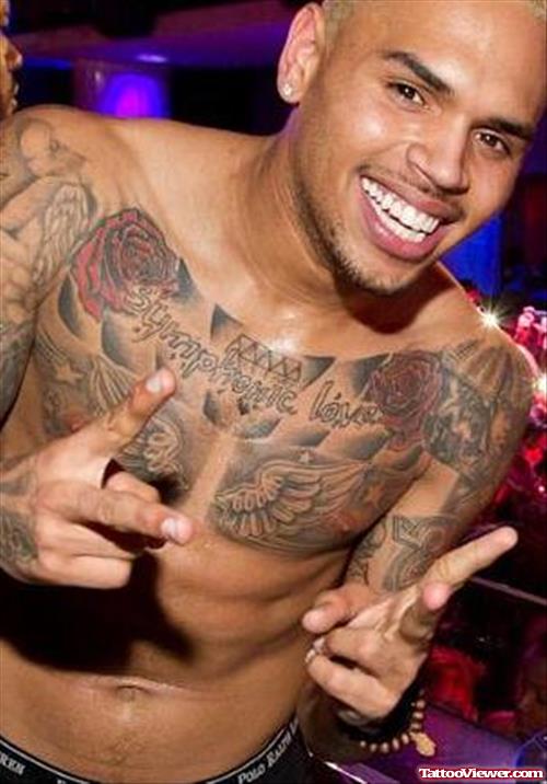 Chris Brown With Angel Wings and Diamond With Rose Flowers Chest Tattoo